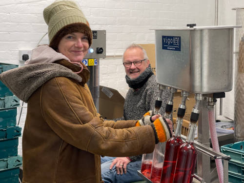 Michael & Irene Rhodes bottling the Wimbushes wine Thurston Place